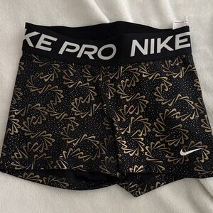 Nike Women's Black and Gold Athletic Shorts